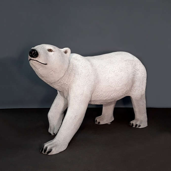 Large polar bear with head raised in resin
